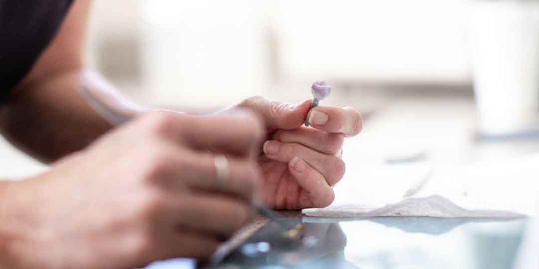 Dentist adjusting a dental crown during a restorative procedure