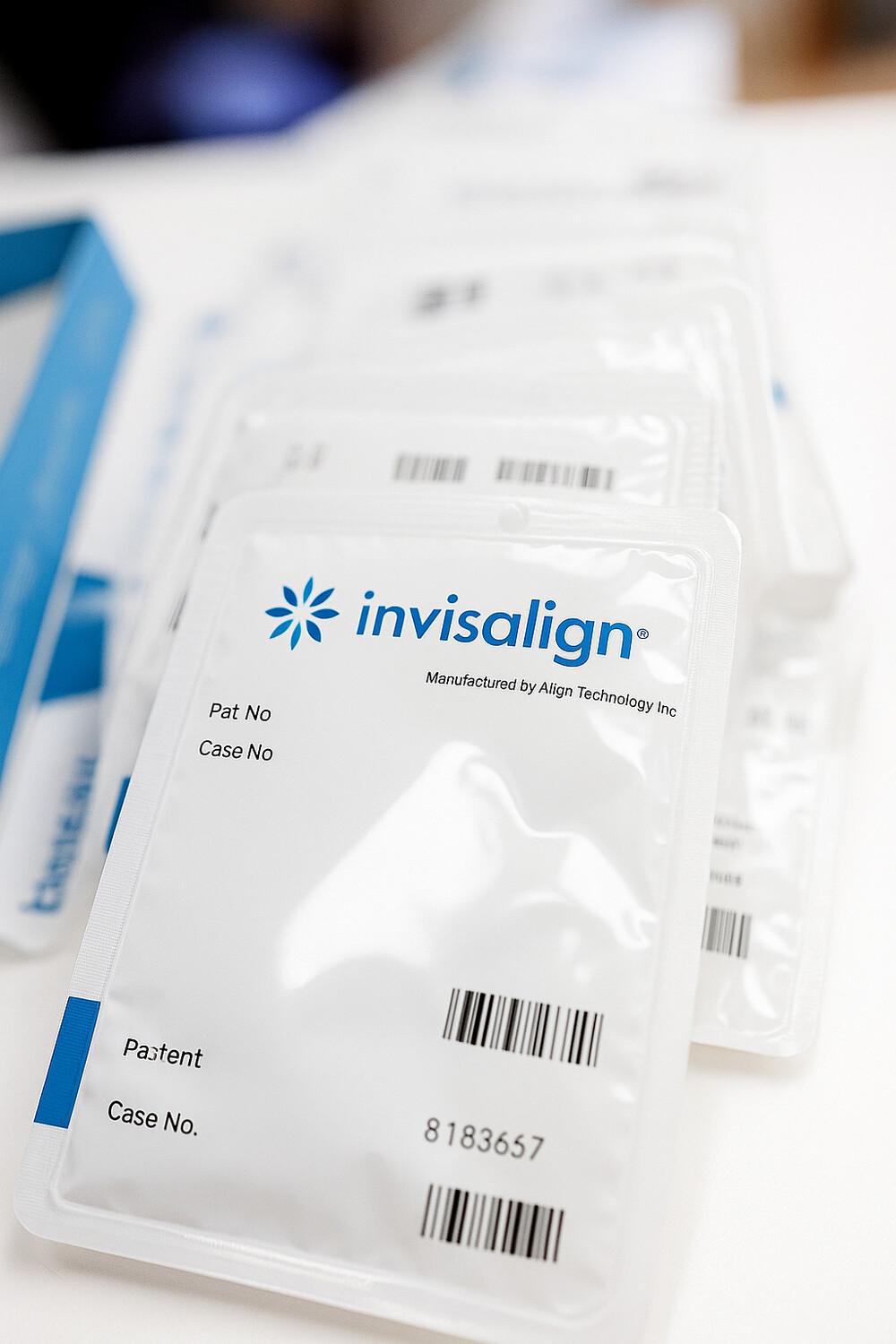 Invisalign aligner trays packaged and ready for patient use