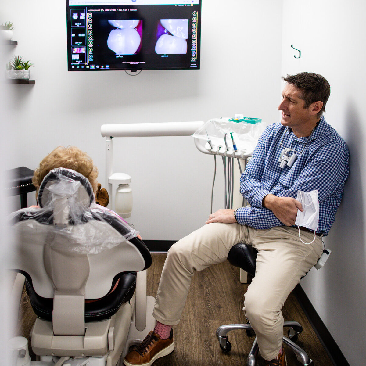 Dentist and assistant performing a routine cleaning during a general dentistry appointment